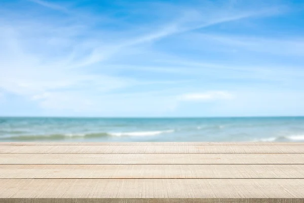 Wood table top on blurred seascape — Stock Fotó