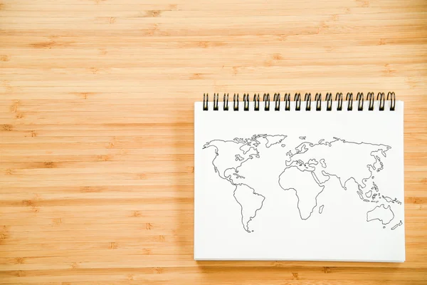 Mapa do mundo esboço no notebook — Fotografia de Stock