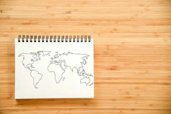 Mapa do mundo esboço no notebook — Fotografia de Stock