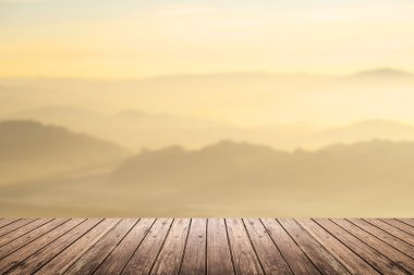 wooden floor with mountain blurred background