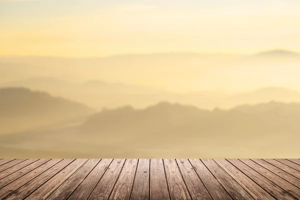 Wooden floor with mountain blurred background — ストック写真