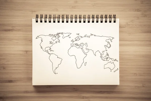 Mapa do mundo esboço no notebook — Fotografia de Stock