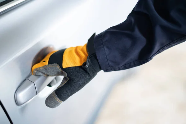 Male Auto Mechanic Hand Wearing Protective Glove Holding Car Door — Stock Photo, Image