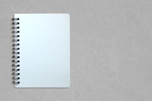 Anteckningsbok på grått papper konsistens — Stockfoto