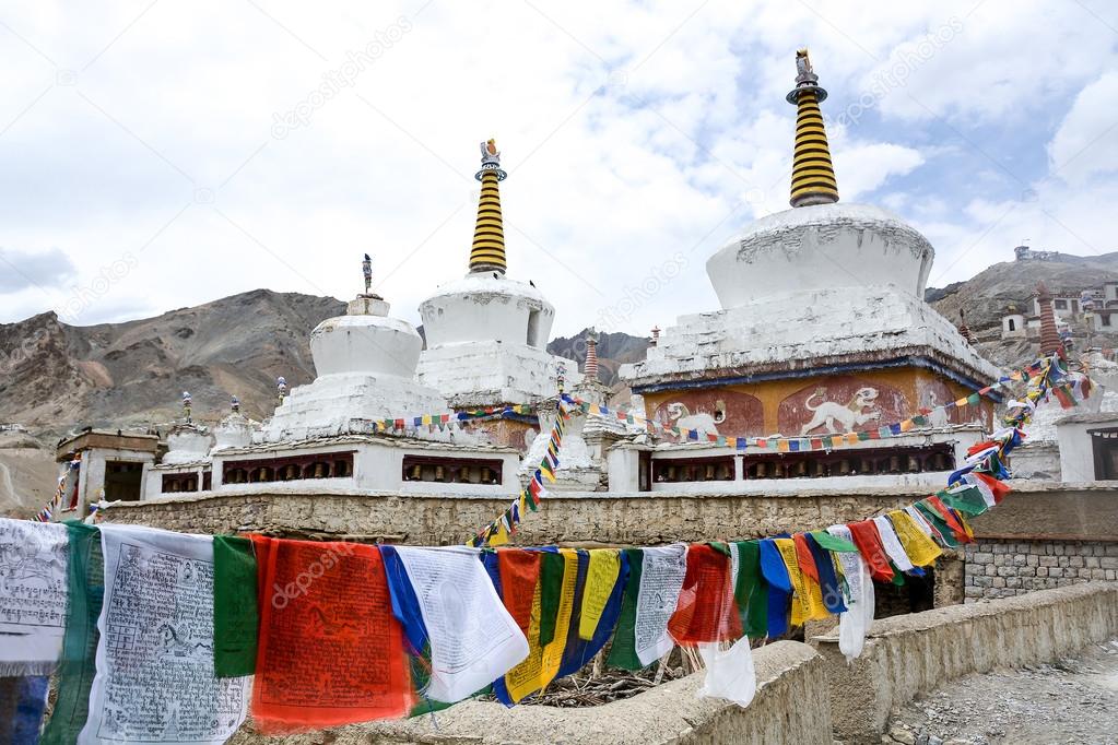 Buddhist stupa and prayer flags in Ladakh, India