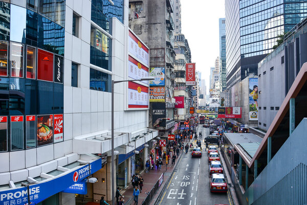HONG KONG, CHINA - JANUARY 23, 2015: Mong Kok District in Kowloon Peninsula, Hong Kong. Mong Kok is the most busy and overcrowded district in Hong Kong.