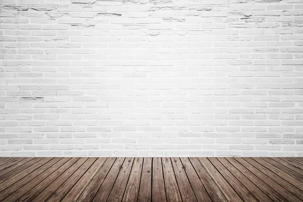 Old interior room with brick wall and wood floor — Stock Photo, Image