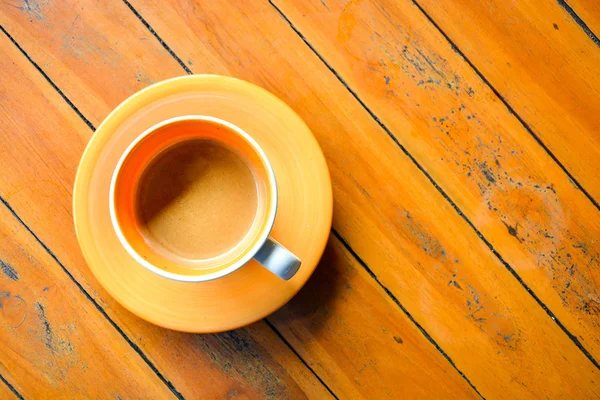 Coffee in ceramic orange cup — Stock Photo, Image