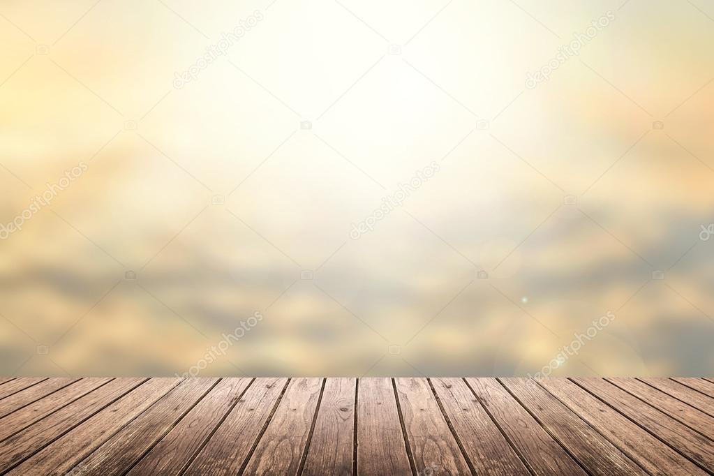 wooden floor with sunset sky blurred background