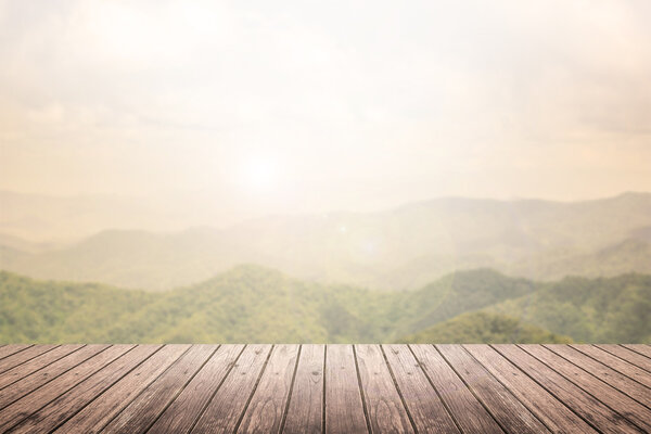 wooden floor with mountain landscape blurred background