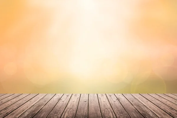 Plancher en bois avec coucher de soleil ciel fond flou — Photo