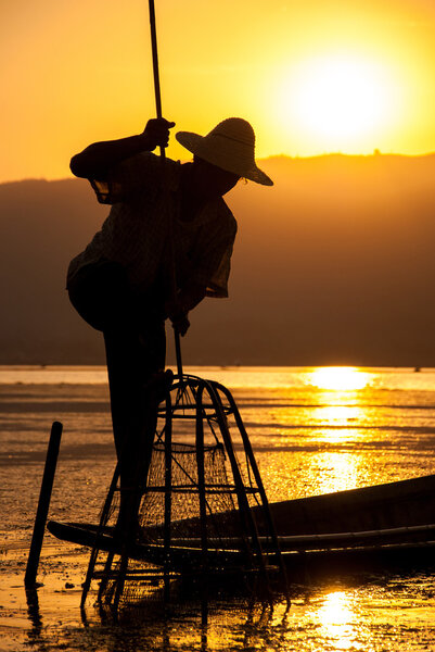 Silhouette fisherman at Inle Lake, Myanmar