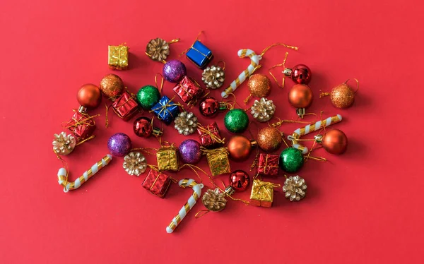Christmas toys on a red background, horizontal photo. New Year. Christmas holidays.