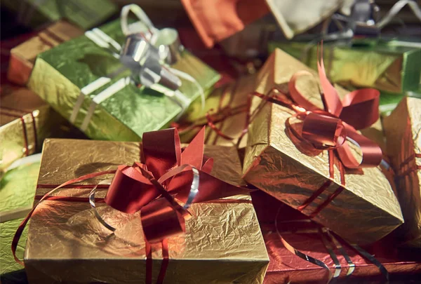 gifts on the background of a wooden table. background, packaging. a bunch of gifts.