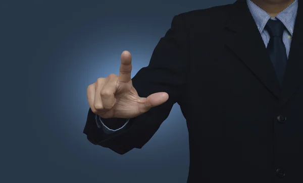 Businessman pointing to something or touching a touch screen on — Stock Photo, Image