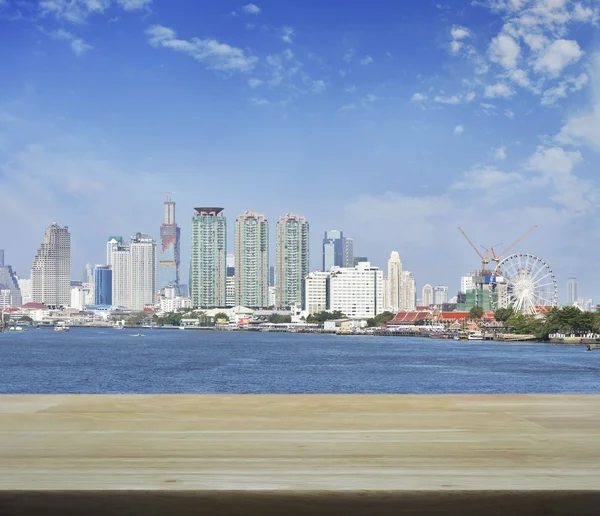 Empty wooden table over business district cityscape for your pro — Stock Photo, Image