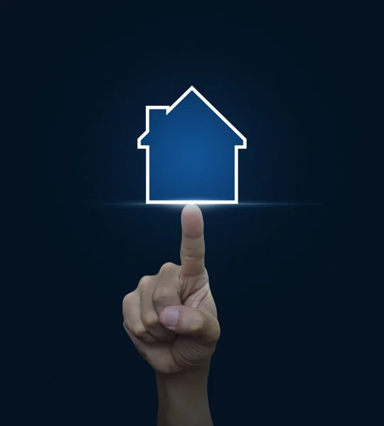Hand pressing house icon with copy space on blue background, Rea — Stock Photo, Image
