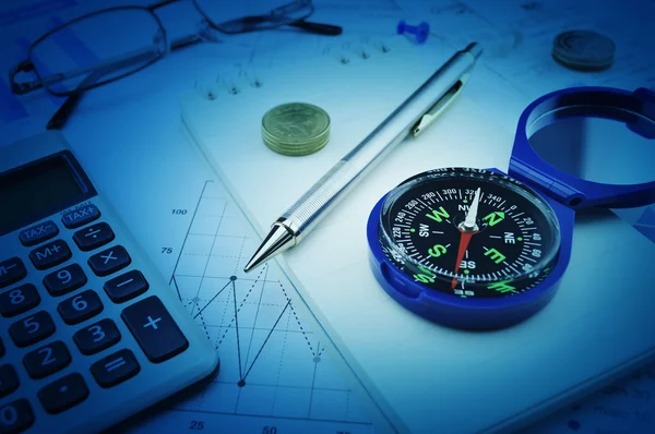 Compass, pen, glasses and coin on notebook, business vision conc — Stock Photo, Image