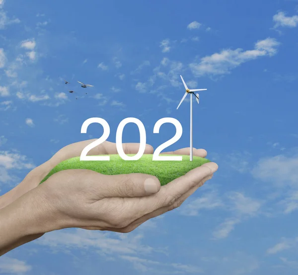 2021 White Text Wind Turbine Green Grass Field Man Hands — Stock Photo, Image