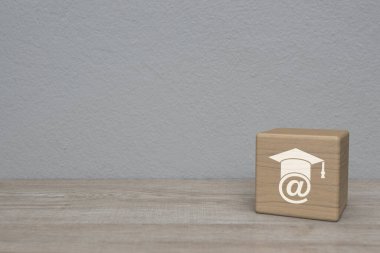 e-learning flat icon on block cube on wooden table over white wall background, Business study online concept