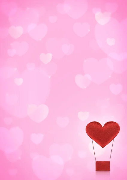 Red heart air balloon on pink heart bokeh background — Stock Photo, Image