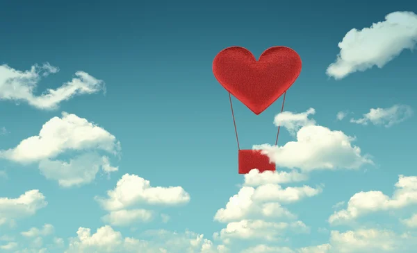 Fabric red heart air balloon on blue sky background — Stock Photo, Image
