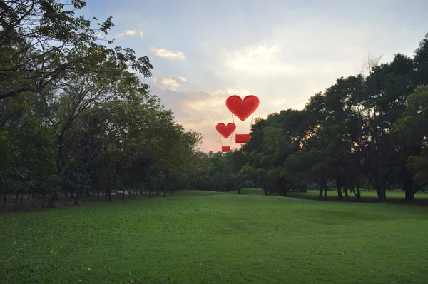 Heart shape air balloon float on evening sky — Stock Photo, Image