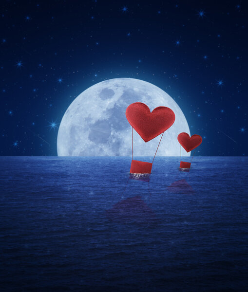 Red fabric heart air balloon on fantasy sea sky and moon, love concept