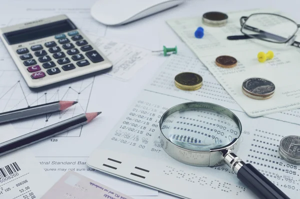 Magnifying glass, pencil, account book, glasses, coin on paper c — Stock Photo, Image