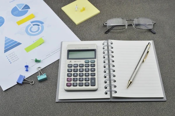 Pen, book, calculator, glasses and financial chart and graph — Stock Photo, Image