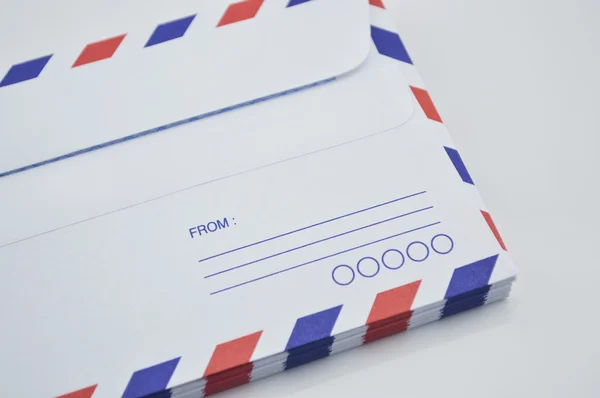 Stack of air mail envelopes on white background — Stock Photo, Image