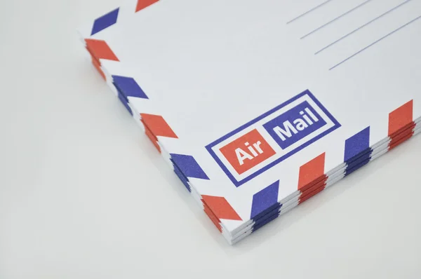 Stack of air mail envelopes on white background — Stock Photo, Image