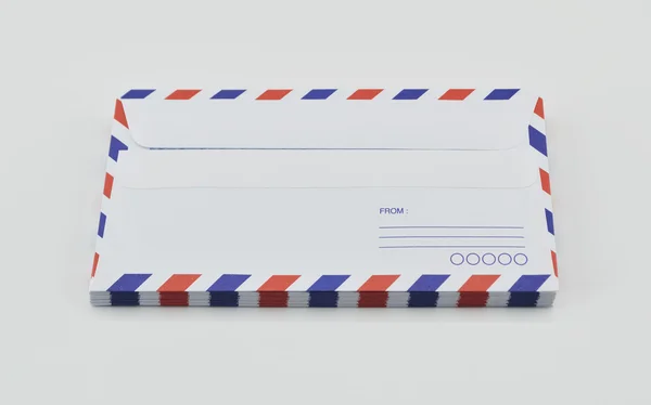 Stack of air mail envelopes on white background — Stock Photo, Image