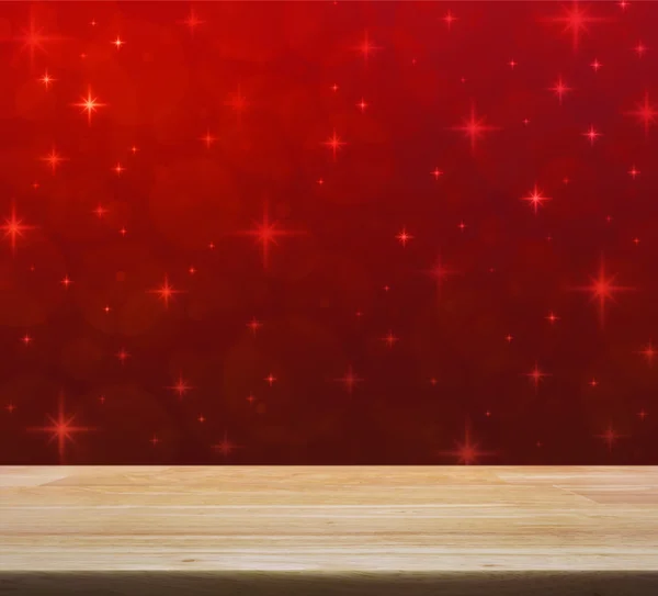 Пустой стол над красным размытым светом с блестящей звездой, рождественский бак — стоковое фото