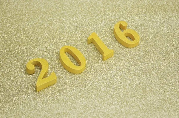 Golden wooden number 2016 over gold background,  New year concep — Stock Photo, Image
