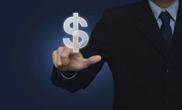 Ділова рука штовхає значок доларової валюти над синім фоном — стокове фото