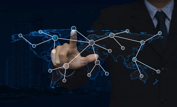 Businessman hand click connection icon with world map over city — Stock Photo, Image