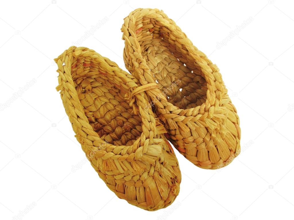 The sandals of yellow wicker straw handmade, holey bast shoes