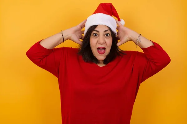 Excited Overjoyed Arab Middle Aged Woman Wearing Christmas Hat Screams — Stock Photo, Image
