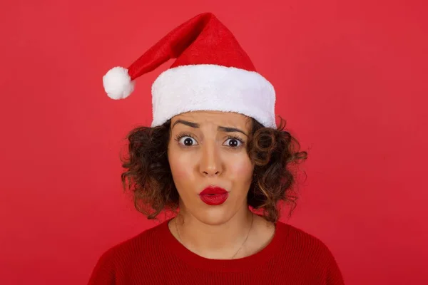 Brunette woman expressing disgust, unwillingness, dislike, disregard having tensive look frowning face. Caucasian woman with pleasant appearance looking indignant digesting something