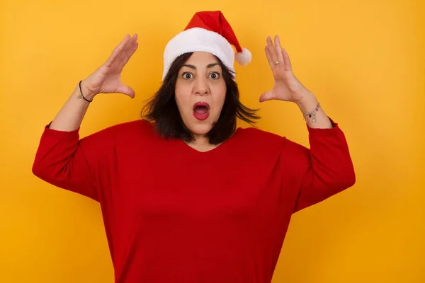 Portrait Arab Middle Aged Woman Wearing Christmas Hat Standing Yellow — Stock Photo, Image