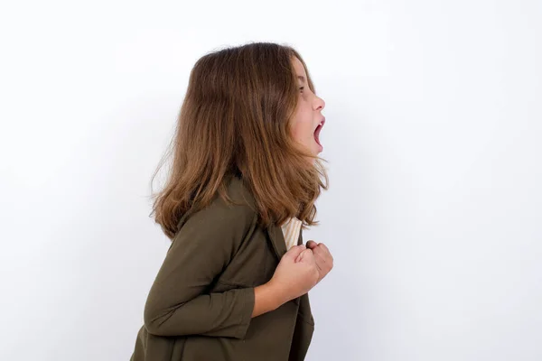 Little Girl Standing White Background Excited Glad Achieve Victory Clenches — Stock Photo, Image