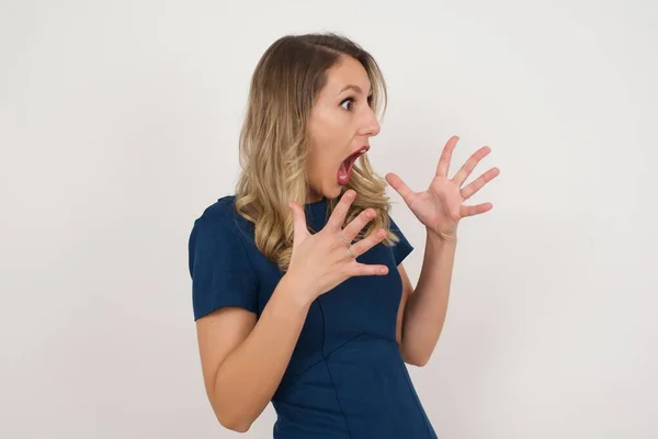 Beautiful Caucasian Blonde Woman Wearing Blue Dress Scared Standing Studio — Stock Photo, Image