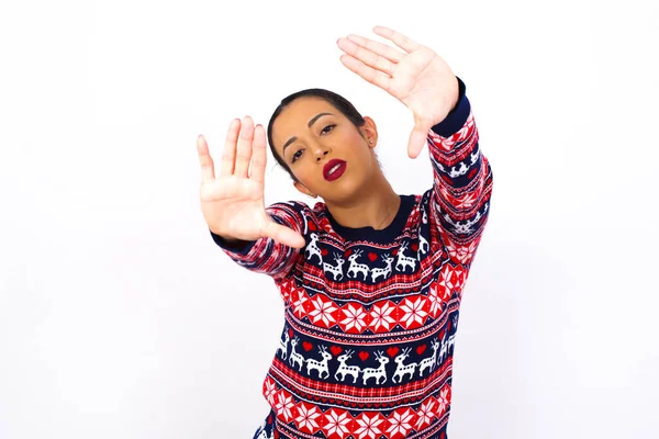 Portrait Smiling Young Woman Wearing Sweater Looking Camera Gesturing Finger — Stock Photo, Image