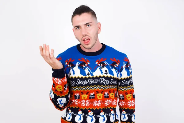 Studio Shot Frustrated Caucasian Man Wearing Christmas Sweater White Wall — Stok fotoğraf