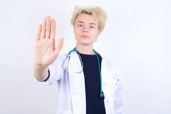 Young Handsome Caucasian Doctor Wearing White Coat Doing Stop Gesture — Stock Photo, Image