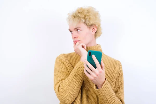 Thinking Dreaming Handsome Caucasian Blond Man Standing White Background Using — Stock Photo, Image