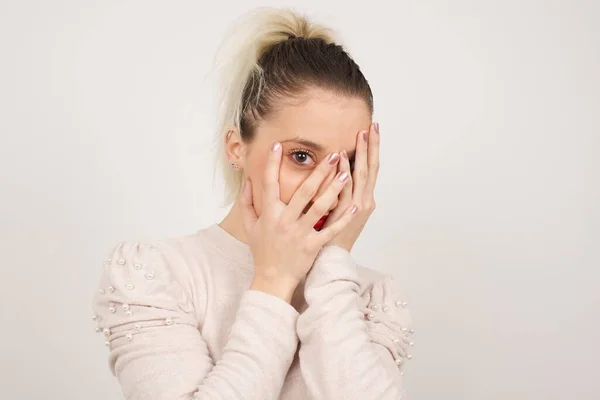 Beautiful Young Caucasian Woman Covering Her Face Her Hands Peering — Stock Photo, Image