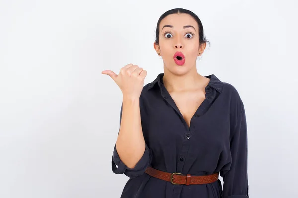 Shocked Young Businessman Woman Wearing Dressn Points Thumb Away Indicates — Stock Photo, Image
