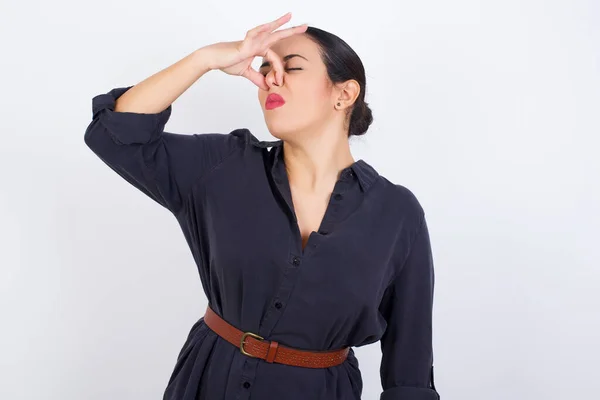 Displeased Young Woman Wearing Dress Plugs Nose Smells Something Stink — Stock Photo, Image